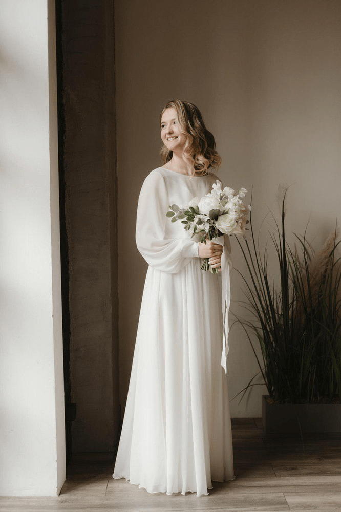Bride in a Nirvana wedding dress.